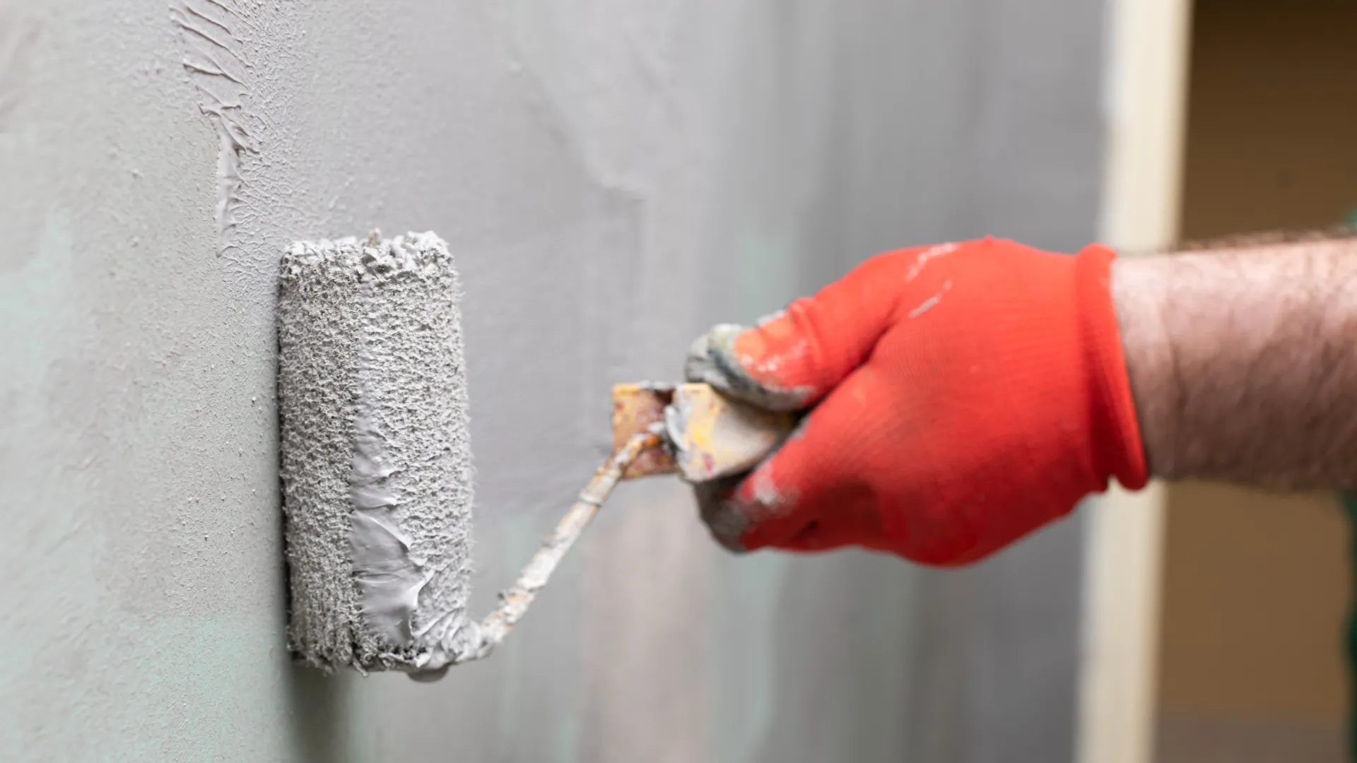 Professional waterproofing application on concrete slab